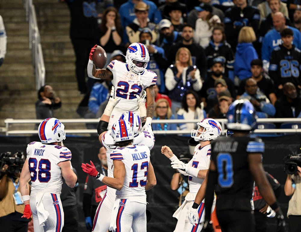 Bills running back Ray Davis (22) is lifted into the air after his touchdown with quarterback Josh Allen, right, in the second half. Detroit Lions vs Buffalo Bills at Ford Field in Detroit on December 15, 2024. Bills win, 48-42. (Robin Buckson, The Detroit News, Tribune Content Agency)