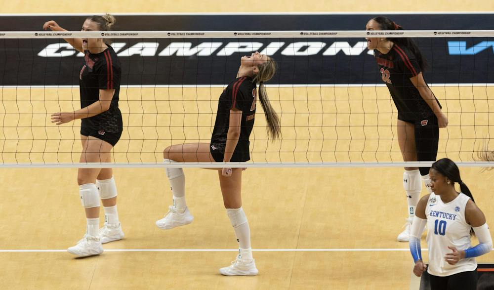 Wisconsin's Charlie Fuerbringer, middle, lets out a yell after the Badgers scored a point against Kentucky during their semifinal match of the NCAA Volleyball Championship in December 2025 at the T-Mobile Center. (Travis Heying/The Wichita Eagle/Tribune Content Agency)