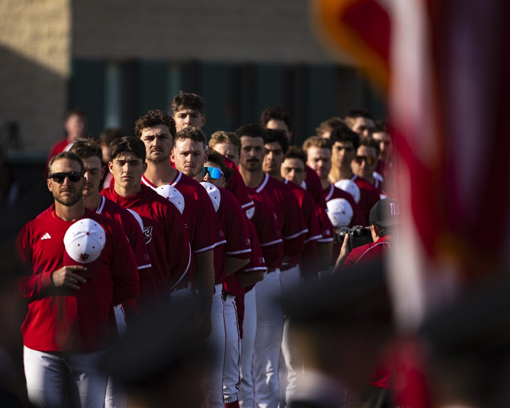 Indiana head coach Jeff Mercer and his team stand at attention during the Star-Spangled Banner before Indiana's loss to Indiana State on March 24, 2026. (HN photo/Brady Owen)
