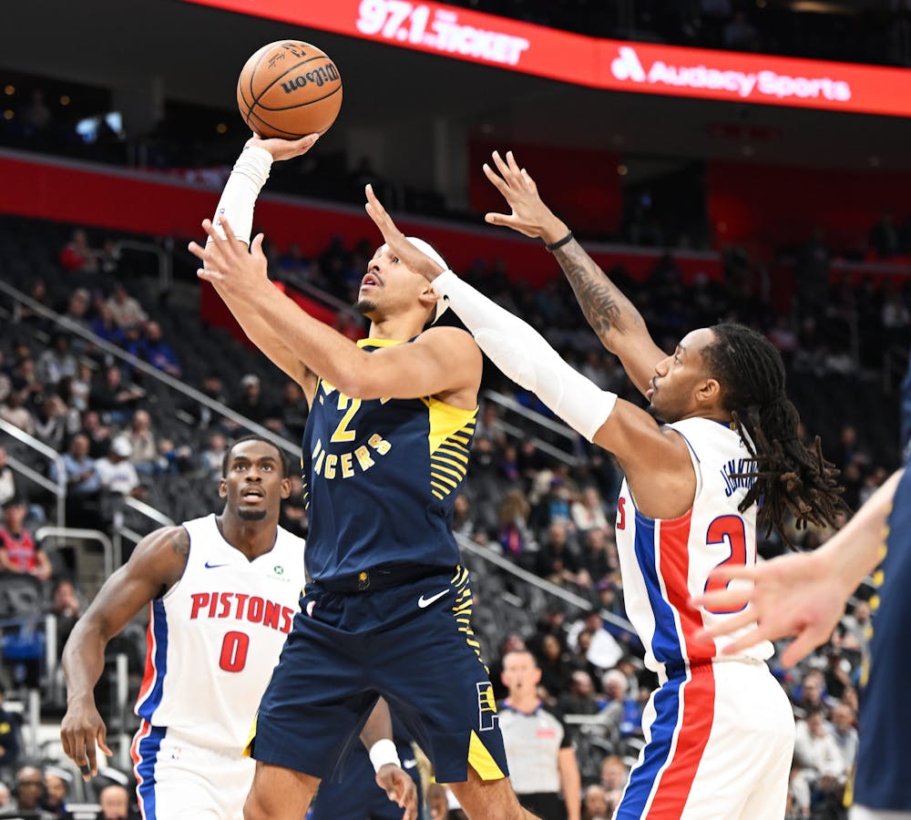 Indiana Pacers guard/forward Andrew Nembhard (2) shoots over Detroit Pistons guard Daniss Jenkins (24) in the first quarter. Detroit Pistons vs Indiana Pacers at Little Caesars Arena on November 17, 2025, in Detroit, MI. (Clarence Tabb Jr./Tribune Content Agency)