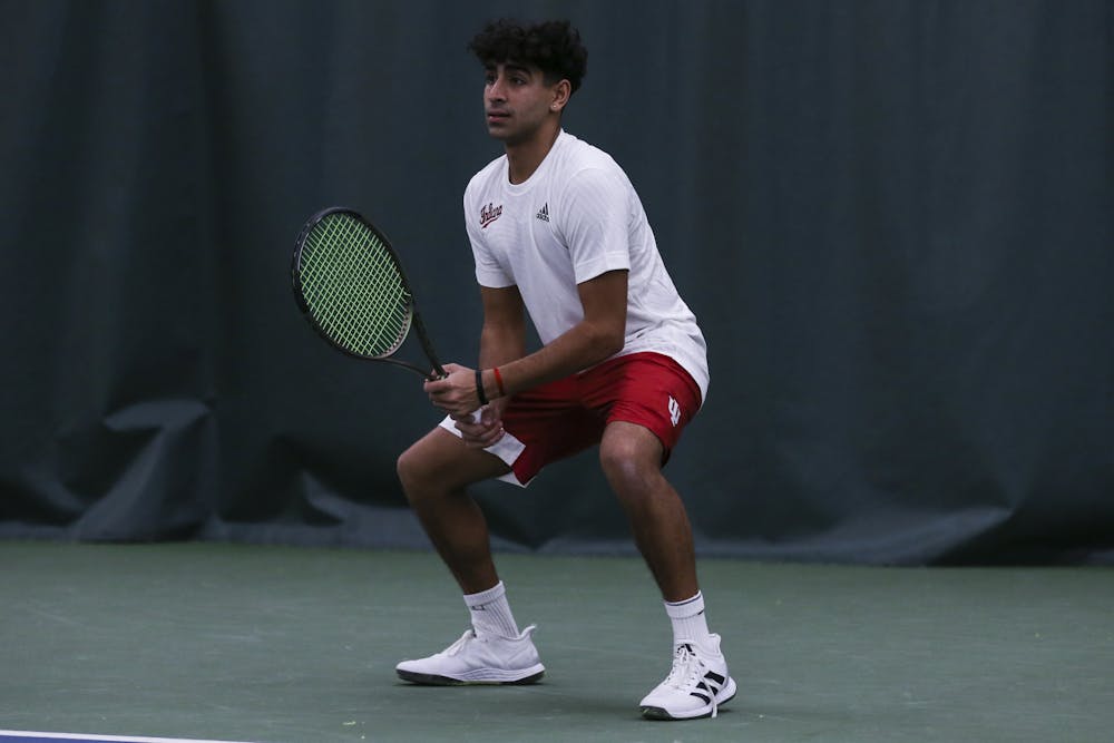Indiana freshman Ekansh Kumar awaits a serve during the match between the Toledo Rockets and the Indiana Hoosiers at the Indiana University Tennis Center in Bloomington. (Photo By Pearson Georges\Indiana Athletics)