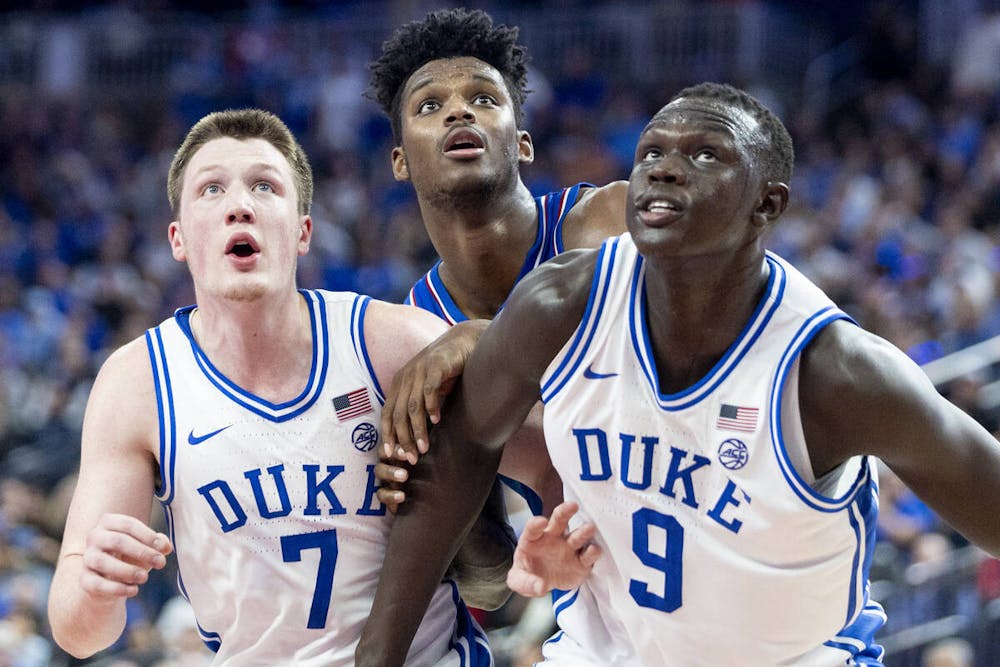 Duke Blue Devils guard Kon Knueppel (7), Kansas Jayhawks forward KJ Adams Jr., center, and Duke Blue Devils center Khaman Maluach (9) look to rebound a free throw during the Vegas Showdown college basketball game at T-Mobile Arena, Tuesday, Nov. 26, 2024, in Las Vegas. (Daniel Jacobi II/Las Vegas Review-Journal/Tribune Content Agency)