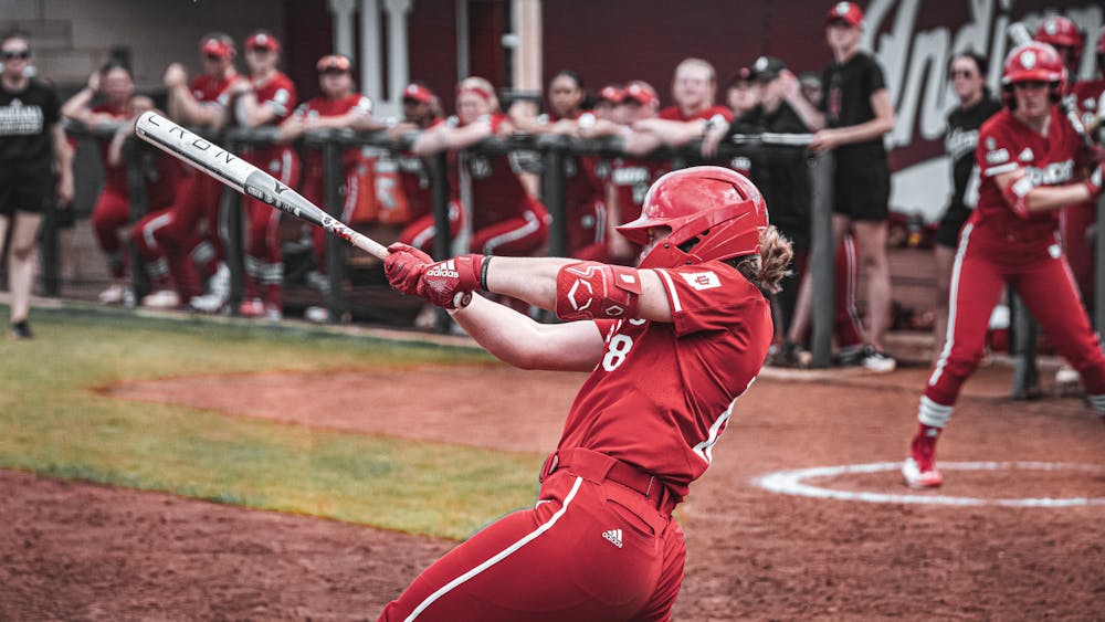 Avery Parker puts a ball in play during a loss to Nebraska on April 15. (HN photo/C.J. Lauretani)