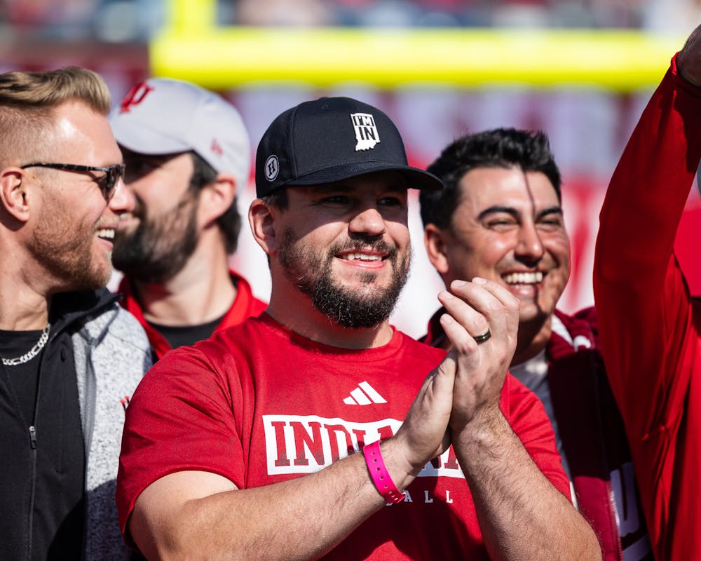 Kyle Schwarber applauds as IU Athletics honors the 2013 College World Series team during halftime of IU's football game against Wisconsin on Nov. 4, 2023. (HN photo/Kallan Graybill)