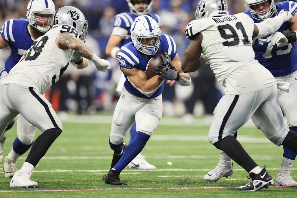 Jonathan Taylor (28) of the Indianapolis Colts runs with the ball during the third quarter against the Las Vegas Raiders at Lucas Oil Stadium on Sunday, Dec. 31, 2023, in Indianapolis. (Andy Lyons/Getty Images/TNS)