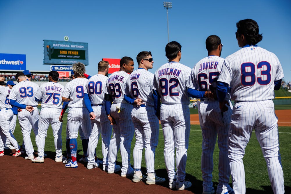 Chicago Cubs right fielder Matt Shaw (6) stands with other players during the national anthem before the Cubs play the Texas Rangers in a Cactus League game at Sloan Park Saturday Feb. 21, 2026 in Mesa, Ariz. (Armando L. Sanchez/Chicago Tribune/TNS)