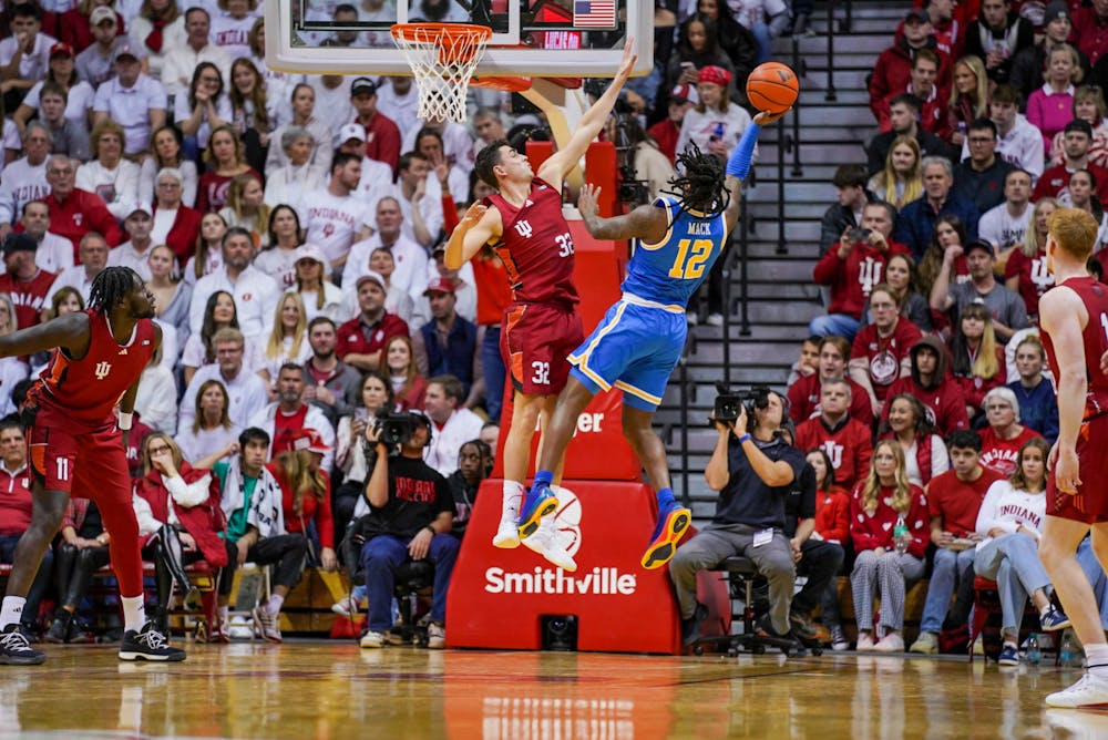 UCLA's Sebastian Mack attempts a layup over Trey Galloway in Indiana's 72-68 loss to UCLA on Feb. 14, 2025. (HN photo/Danielle Stockwell)