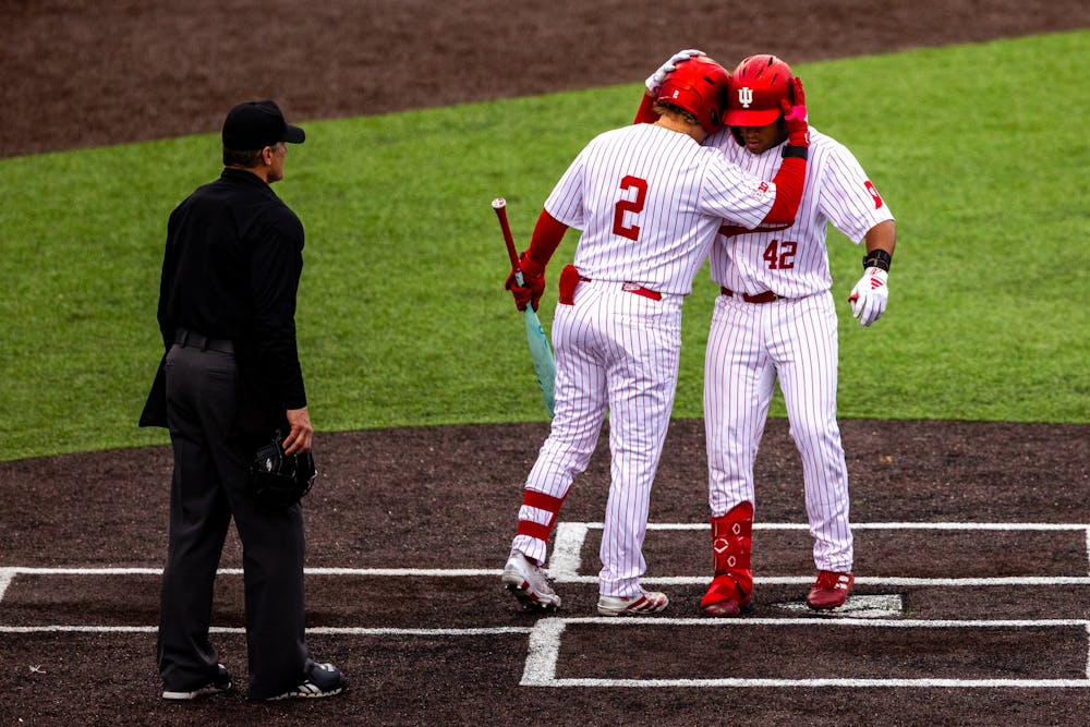Hogan Denny (2) greets Brayden Ricketts at home plate after Ricketts' home run during Indiana's loss to Abilene Christian on April 18, 2026. (HN photo/Lauren McKinney)