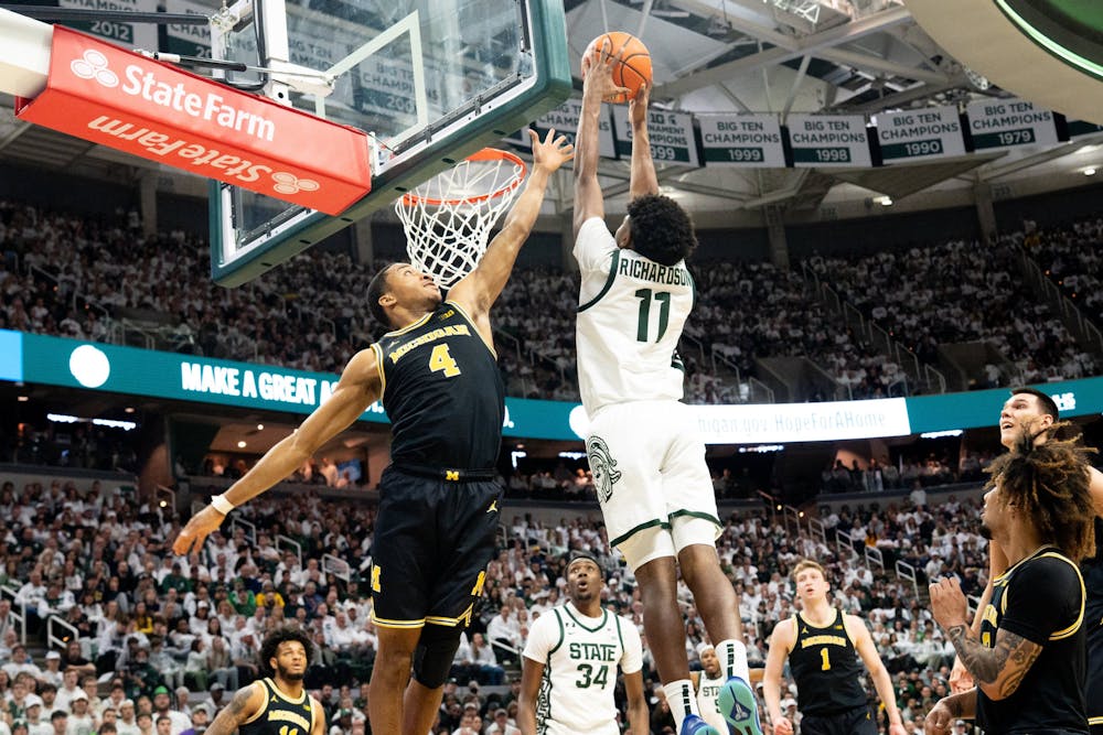 Michigan State guard Jase Richardson (11) dunks the ball during a basketball game at the Breslin Center on Sunday, March 9, 2025. Michigan State hosted Michigan. (Devin Anderson-Torrez/Tribune Content Agency)