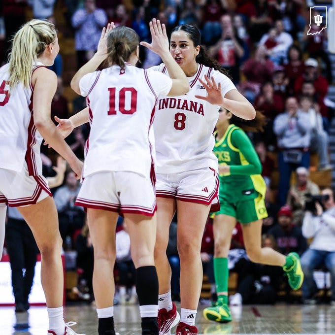 Edessa Noyan and Shay Ciezki embrace during the Hoosiers win