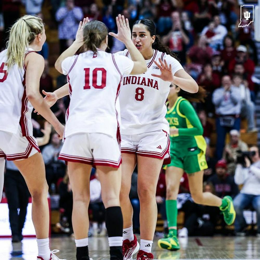 Edessa Noyan and Shay Ciezki embrace during the Hoosiers win