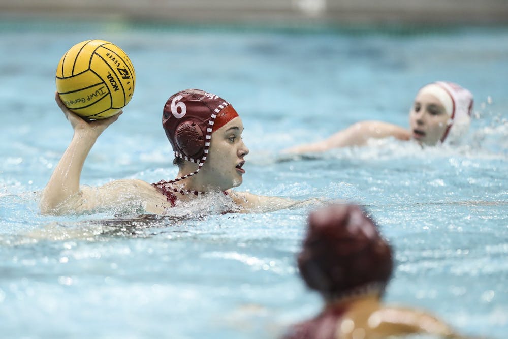 <p>Sophomore attacker Lanna Debow makes a pass Feb. 20 at the Counsilman-Billingsley Aquatics Center. The Hoosiers lost two home matches this weekend to Michigan. </p>