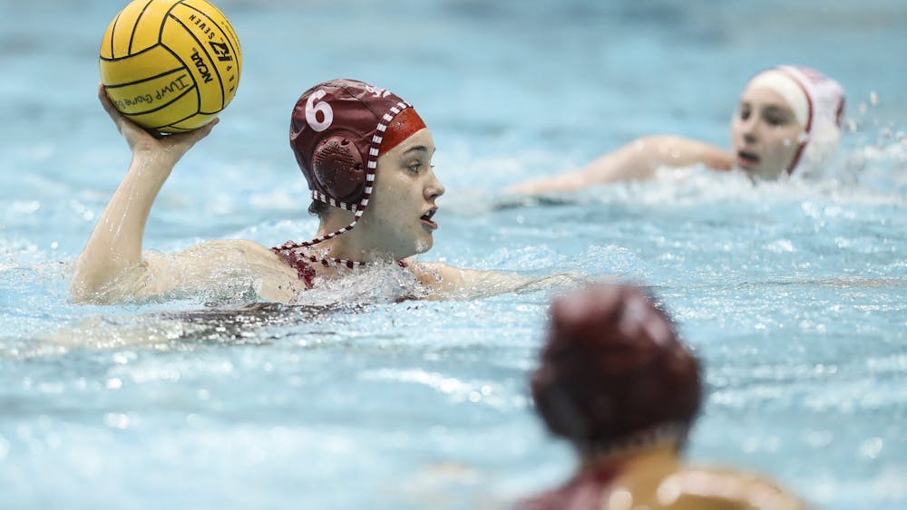 Sophomore attacker Lanna Debow makes a pass Feb. 20 at the Counsilman-Billingsley Aquatics Center. The Hoosiers lost two home matches this weekend to Michigan. 