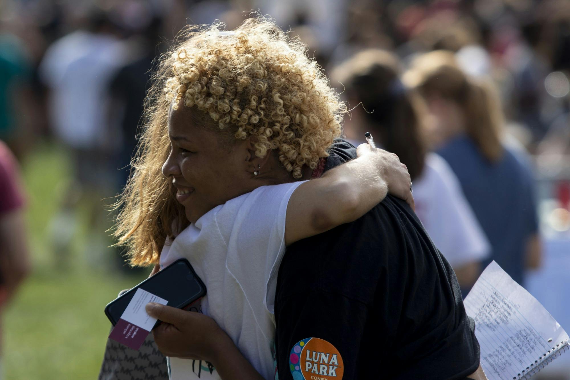 Then-sophomore Xakilah Daniel hugs then-senior Ellie Johnson during the Student Involvement Fair on Aug. 29, 2019, in Dunn Meadow. The fair and many other extracurricular events have been changed due to the coronavirus pandemic.