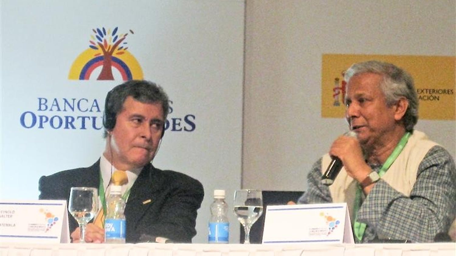 Reynold Walter, executive director of FAFIDESS, a non-governmental organization in Guatemala, listens attentively as Professor Muhammad Yunus, founder and director of Grameen Bank, discusses the importance of financial literacy at all socioeconomic levels Tuesday at the Latin American-Caribbean Regional Microcredit Summit in Cartagena, Colombia.