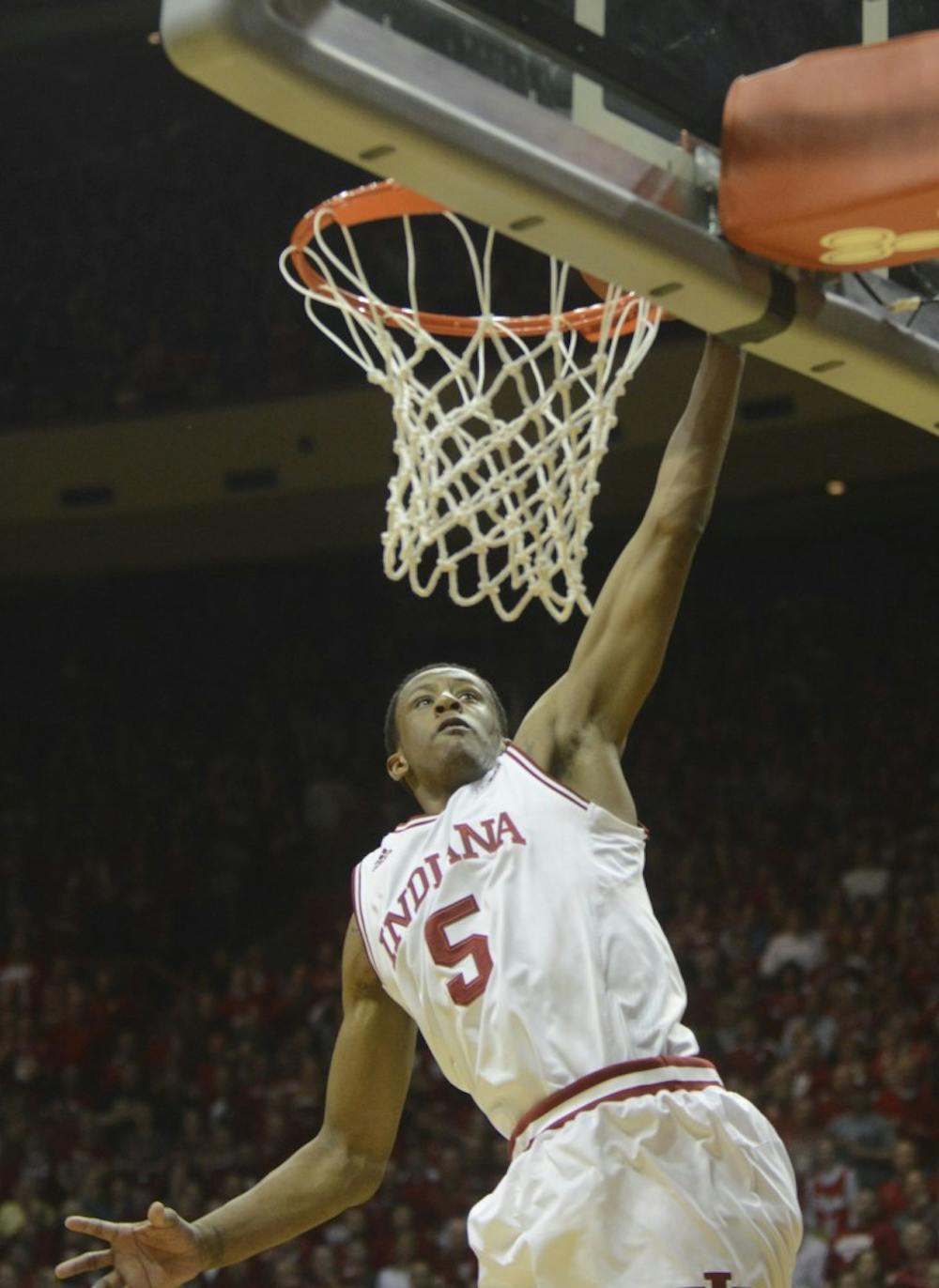 Junior forward Troy Williams dunks during the game against Purdue on Saturday at Assembly Hall.