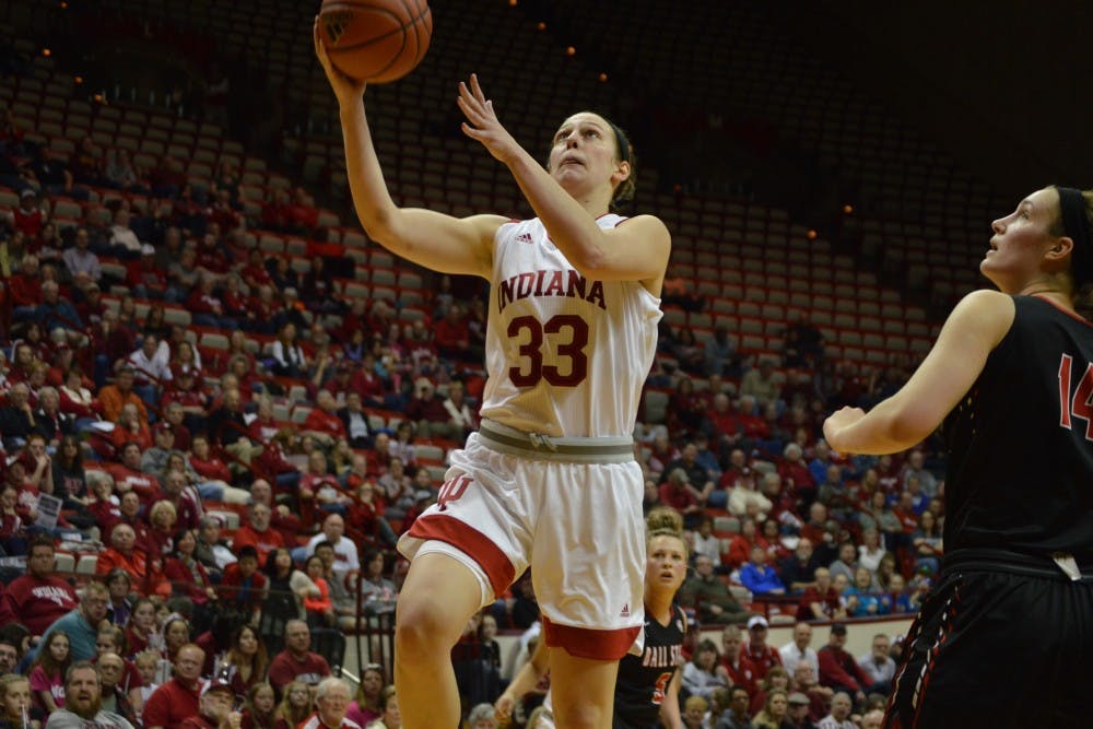 Junior forward Amanda Cahill jumps while shooting the ball to score for the Hoosiers Thursday evening. IU beat Ball State 71-58 with 16 points from Cahill.