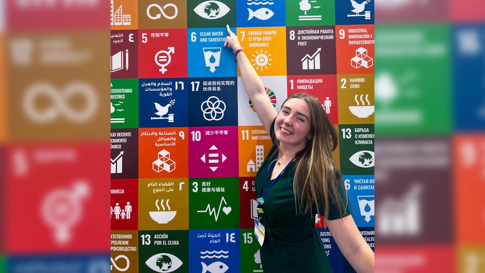 IU senior Liv Davis stands in front of the Sustainable Development Goals Pavilion on Nov. 20, 2022, at the 27th Conference of the Parties in Sharm El Sheikh, Egypt.