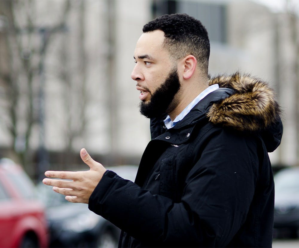 Dorian Davis, a first year grad student at IU, stands at the spot Monday at Kirkwood where the alleged hate crime took place. "Being here is sort of surreal right now," he said.