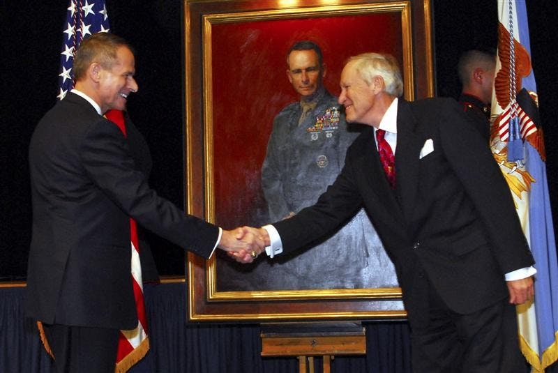 Former chairman of the Joint Chiefs of Staff, retired Marine Corps Gen. Peter Pace greets portrait artist Peter E. Egeli following the unveiling of Pace's portrait. The portrait was unveiled Friday during a ceremony at the Pentagon. The painting will be displayed in a corridor of the Pentagon along with portraits of other former chairmen.