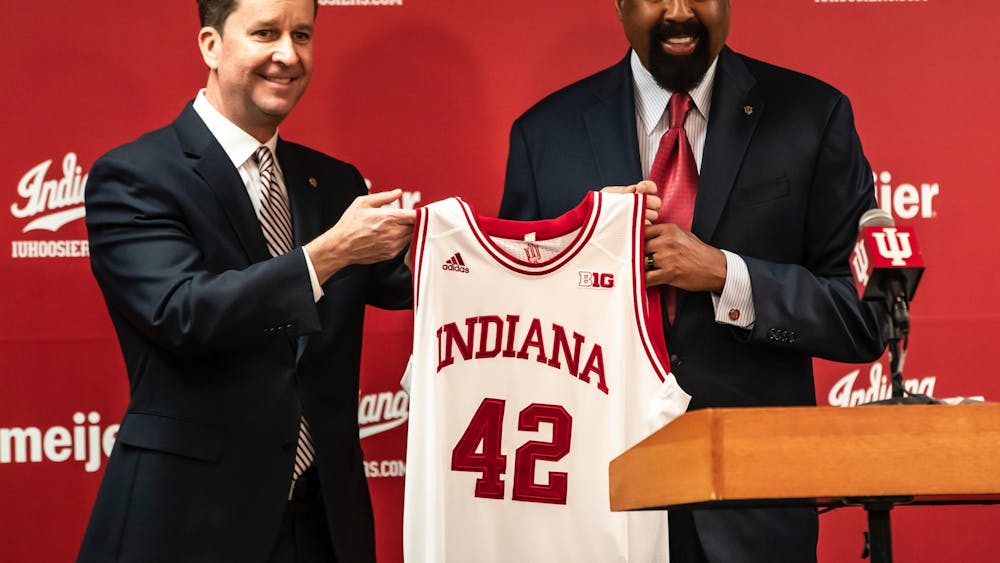 Indiana men&#x27;s basketball head coach Mike Woodson Indiana University athletic director Scott Dolson hold a jersey during a press conference on March 29, 2021, in Bloomington. Indiana held its annual preseason media day Monday. 