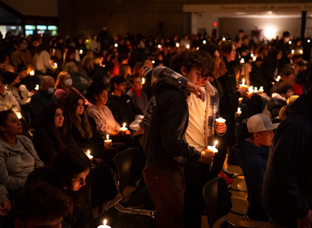 <p>Oxford High School students stand during a prayer vigil following the deaths of four students in a shooting at Oxford High School on Nov. 30, 2021, at LakePoint Community Church in Oxford, Michigan. </p>