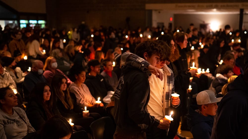 Oxford High School students stand during a prayer vigil following the deaths of four students in a shooting at Oxford High School on Nov. 30, 2021, at LakePoint Community Church in Oxford, Michigan. 