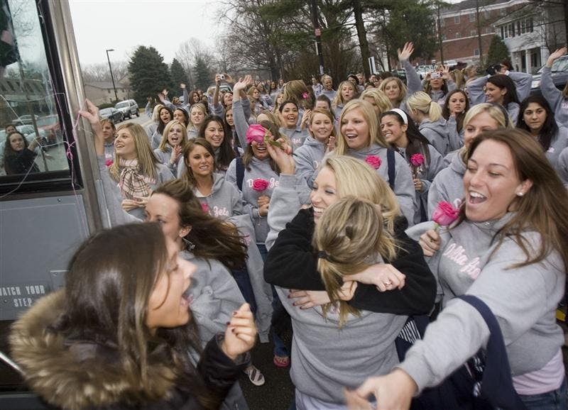 Two new members of Delta Zeta are greated by a sea of sisterhood after stepping off the bus on Jan. 7, 2007 at the sorority house.