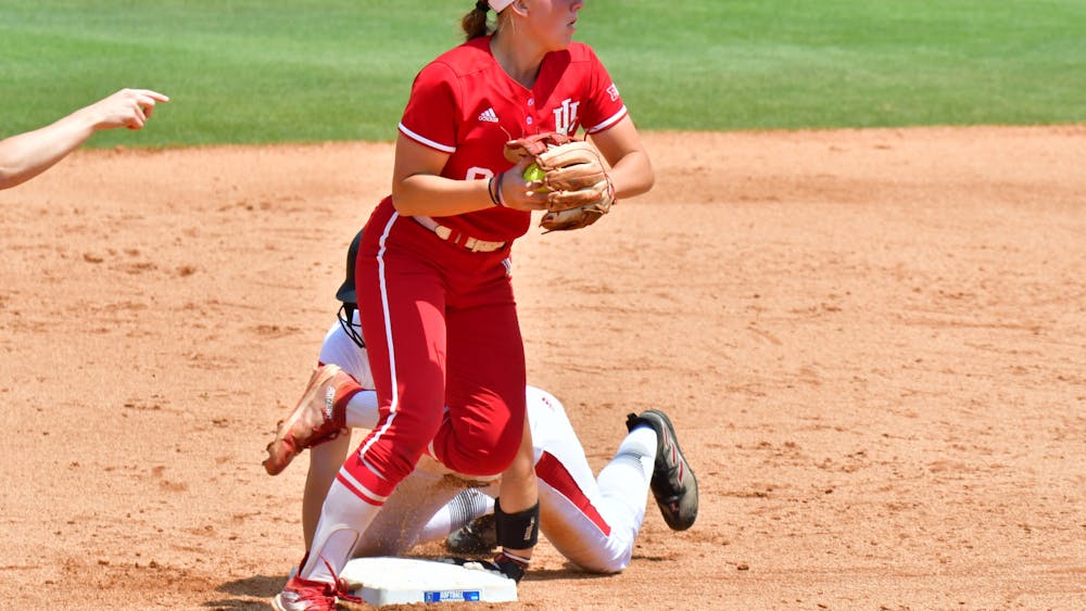 Indiana softball freshman infielder Taryn Kern transfers the ball against the University of Louisville May 21 at the NCAA Tournament. Kern was named an All-American by D1Baseball Tuesday. 