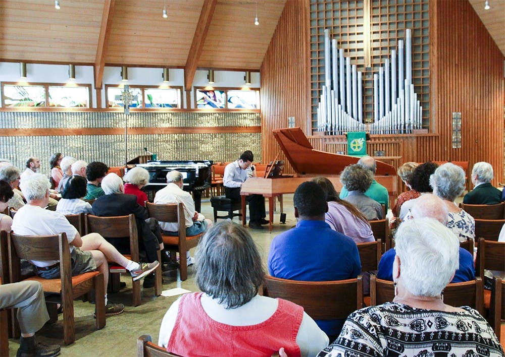 Mike Lee performs on Sunday at the St. Thomas Lutheran Church. This performance was part of the Bloomington Early Music Festival that happened between May 25-29.