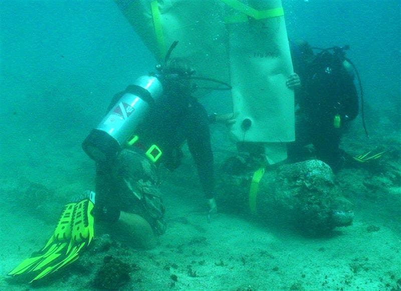 Fritz Hanselmann prepares to recover one of the Captain Kidd "great guns."