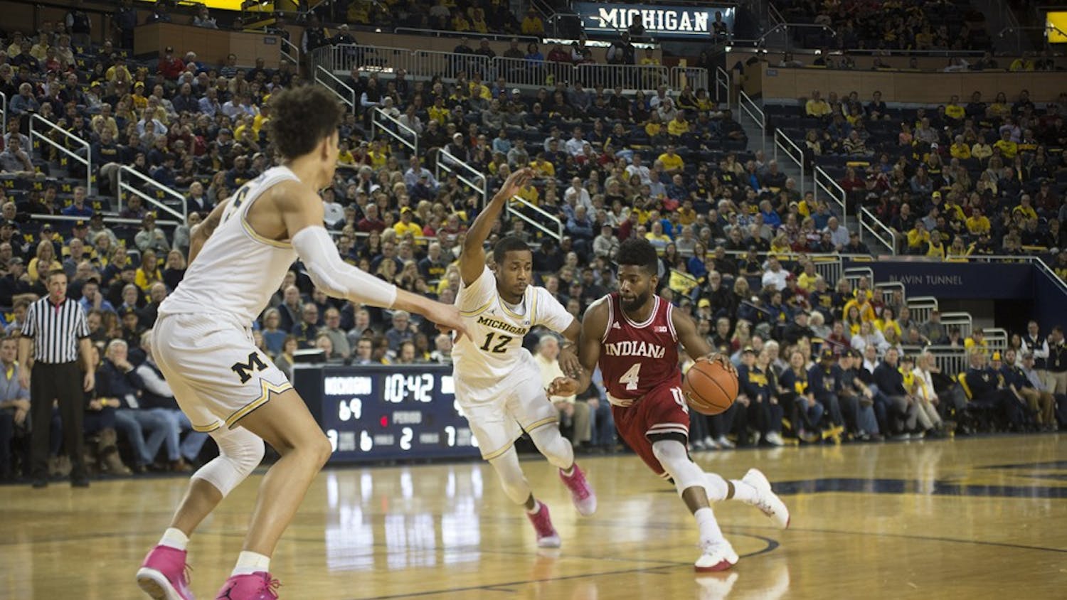 Junior guard Robert Johnson drives to the basket against Michigan in a loss Thursday. Johnson led IU in scoring with 14 points.