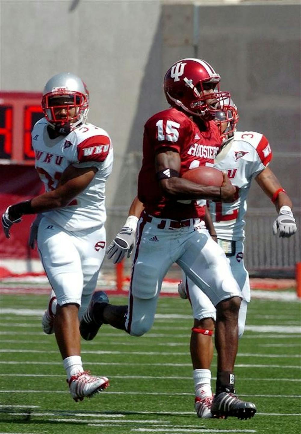 IU quarterback Kellen Lewis gets away from Western Kentucky defenders to score his first touchdown on a 75-yard run in the first half during a game on Aug. 30, 2008 at Memorial Stadium. IU won 31-13.