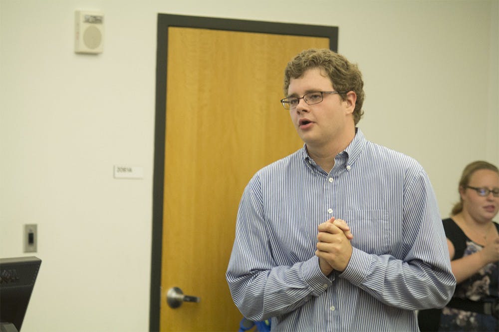 Jonathan Kreilein, president of IU Republicans, speaks with students and other attendees of the callout meeting on Tuesday night.