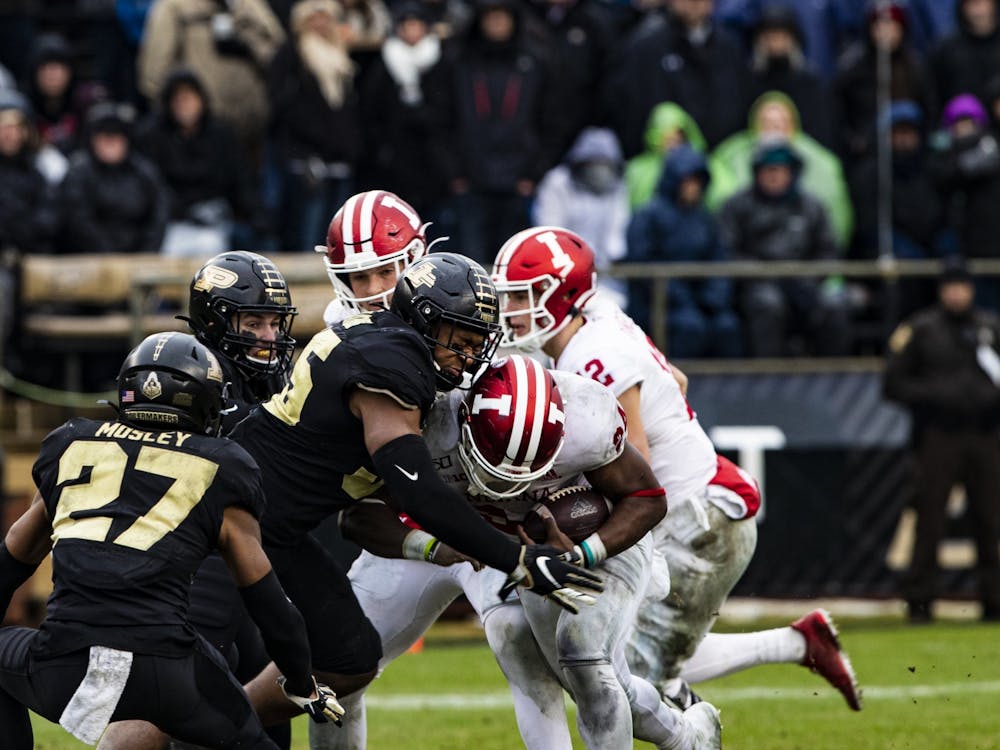 Purdue football players tackle then-freshman running back Sampson James on Nov. 30, 2019, at Ross-Ade Stadium in West Lafayette, Indiana. 