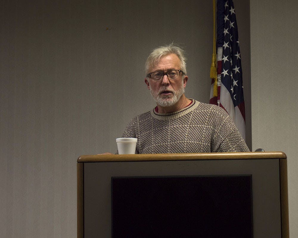 Bloomington resident Brian Garvey opens the meeting of the Citizens for Appropriate Rural Roads, Inc. at the Monroe County Library on Thursday. CARR discussed problems and costs associated with I-69 construction. 
