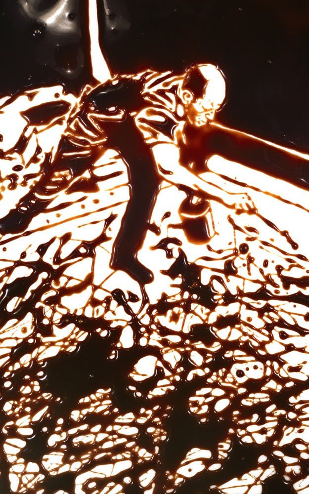 Action Photo (after Hans Namuth) from the Pictures in Chocolate series, 1998. Dye destruction print. Galerie Xippas, Paris. Art © Vik Muniz/Licensed by VAGA, New York, NY