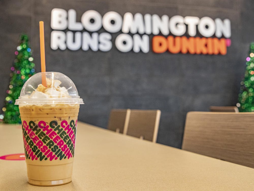 A Caramel Craze iced latte sits on a table Dec. 7 inside a Dunkin’ and Baskin Robbins in Bloomington. Dunkin’ had its opening day Monday and is located on the corner of Third Street and South College Mall Road.
