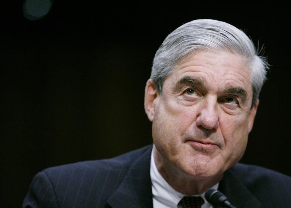 <p>Robert Mueller testifies before a Senate Intelligence Committee hearing in February 2011 in Washington, D.C. The report made by Mueller in his role as special counsel did not conclude that the president committed a crime.</p><p></p>