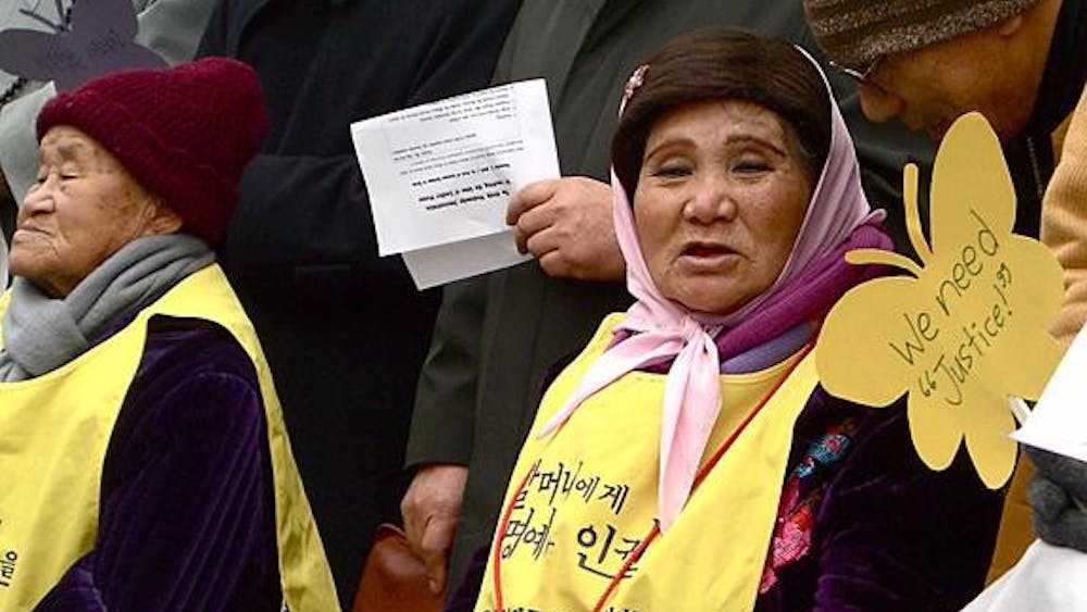 A former Japanese military 'comfort woman' calls for justice at a protest outside the Japanese embassy Dec. 2 in Seoul.