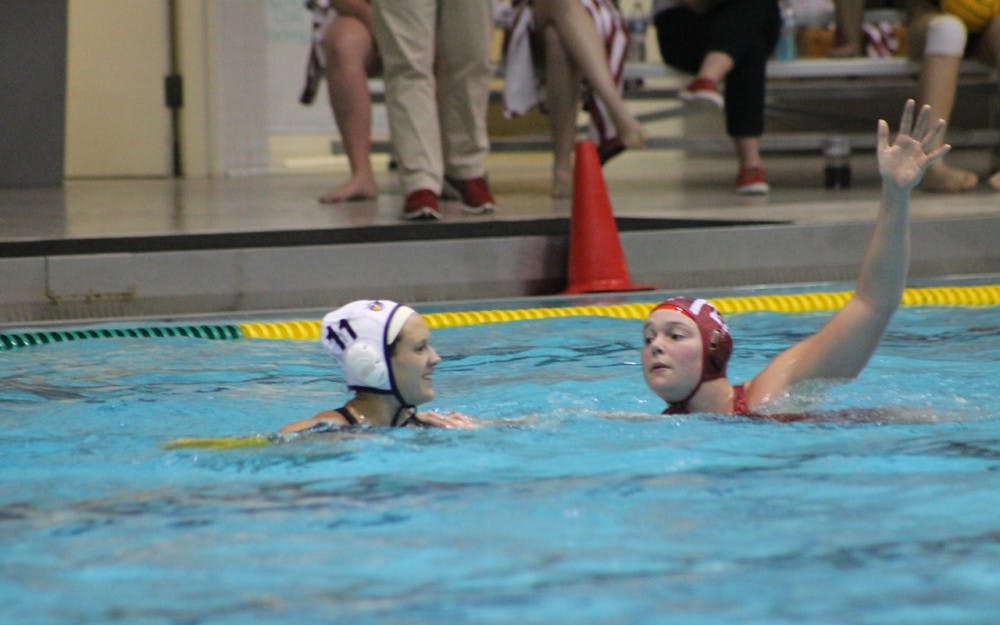 Junior Sarah Young looks to block a pass by California Baptist University junior Allie Coleman in Saturday's match. Young scored five goals to help the Hoosiers defeat the Lancers 13-6.
