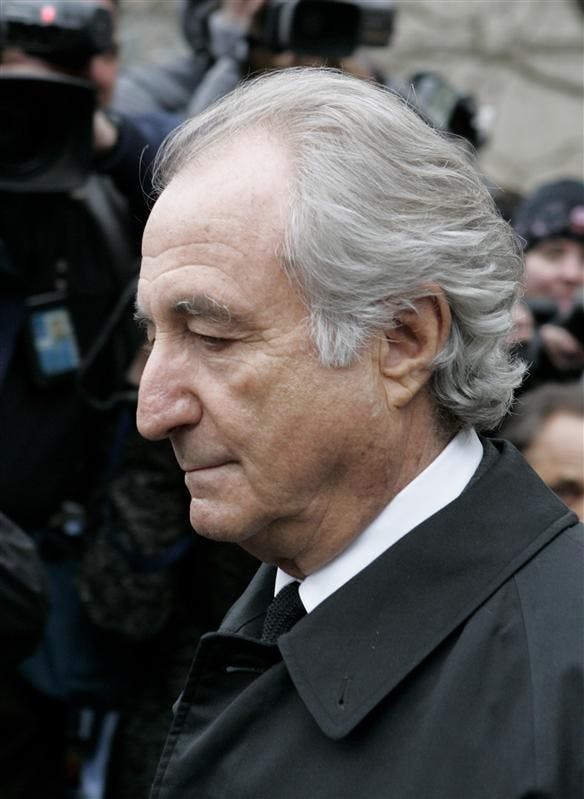 In this March 10, 2009, photo, Bernard Madoff exits Manhattan federal court in New York. U.S. District Judge Denny Chin said Monday that the federal probation department recommends that Madoff get 50 years in prison.