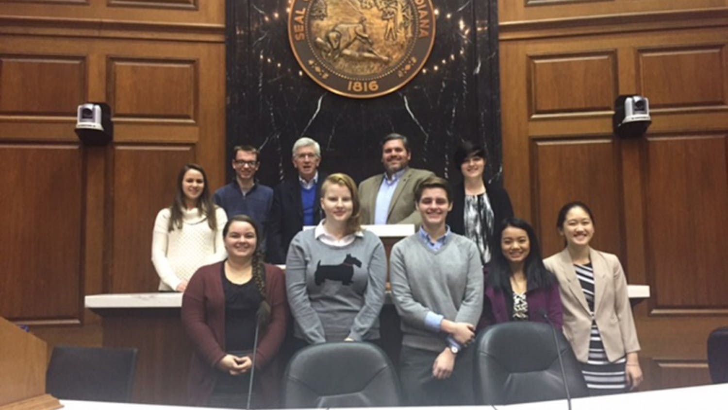 Eight of the high school and college New Voices of Indiana team members meet at the Indiana Statehouse, Wednesday, Dec. 7 to draft legislation for a press freedoms bill. They met with stakeholders who would be interested in the legislation.