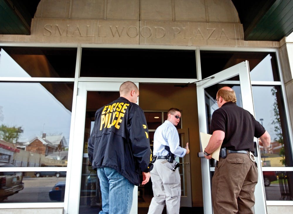 Excise police enter Smallwood Plaza in 2007. Excise is the arm of Indiana’s police focused on alcohol and tobacco law enforcement.