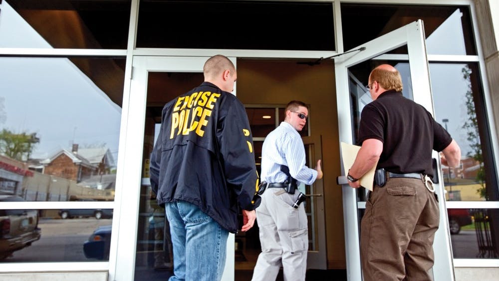 Excise police enter Smallwood Plaza in 2007. Excise is the arm of Indiana’s police focused on alcohol and tobacco law enforcement.