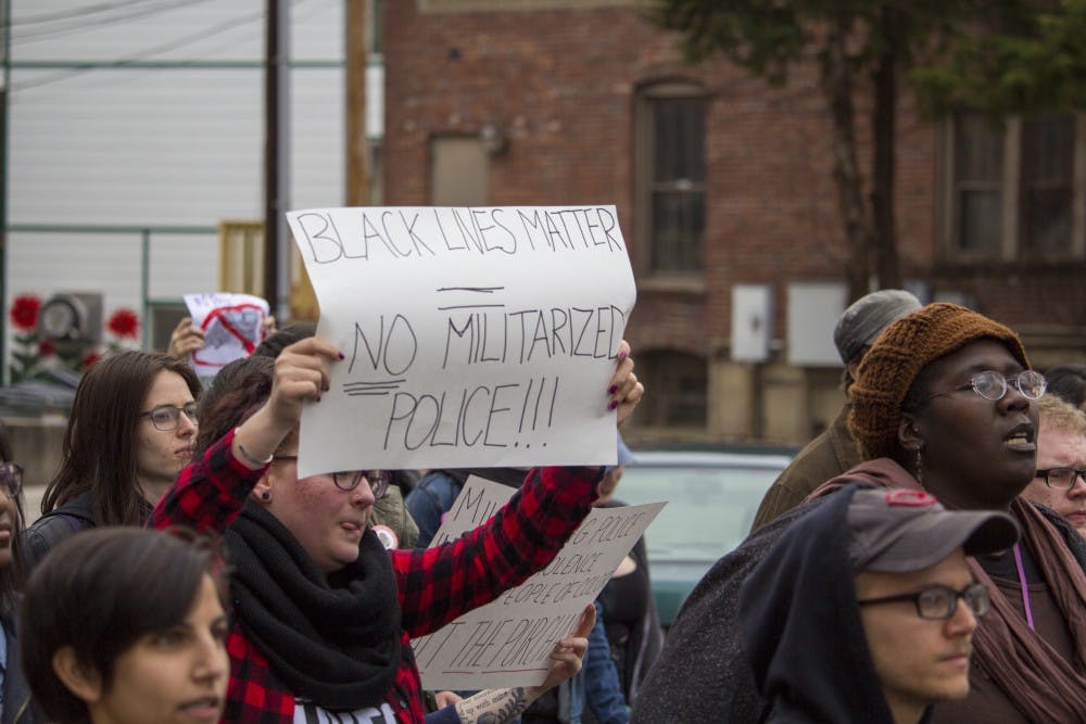 <p>Members of Bloomington’s Black Lives Matter arrive at City Hall to protest the Lenco Bearcat G2 armored vehicle. Members of Both BLM and the Young Democratic Socialists chanted through the streets of Bloomington on Wednesday night.&nbsp;</p>