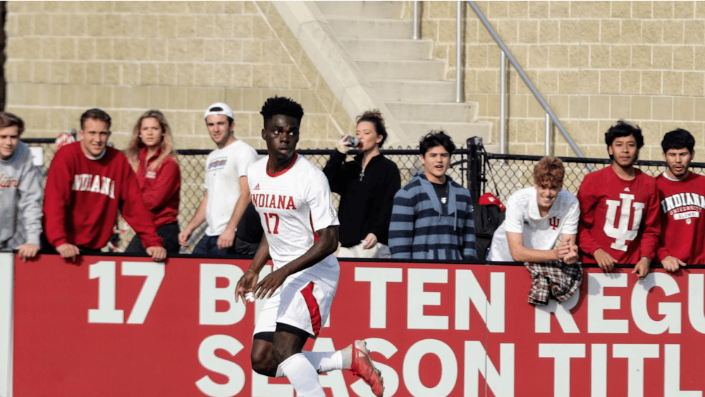 Then-junior forward Herbert Endeley looks to pass the ball against Northwestern on Nov. 10, 2021, at Bill Armstrong Stadium. Indiana men&#x27;s soccer will face No. 2 University of Kentucky at 7 p.m. Oct. 22 in Bloomington.