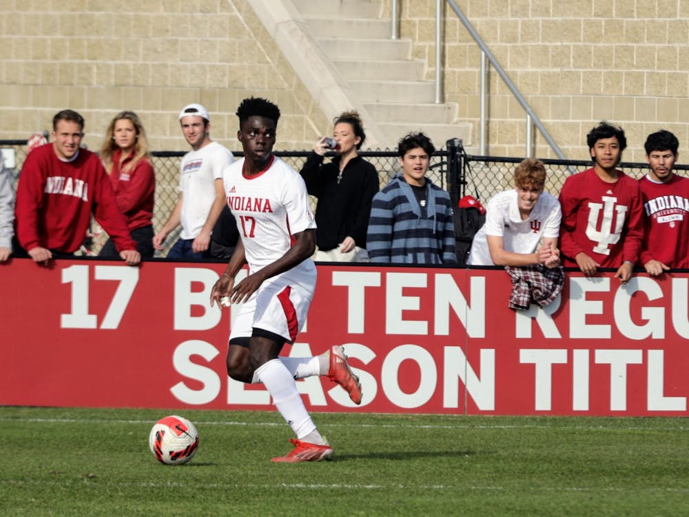 Then-junior forward Herbert Endeley looks to pass the ball against Northwestern on Nov. 10, 2021, at Bill Armstrong Stadium. Indiana men&#x27;s soccer will face No. 2 University of Kentucky at 7 p.m. Oct. 22 in Bloomington.