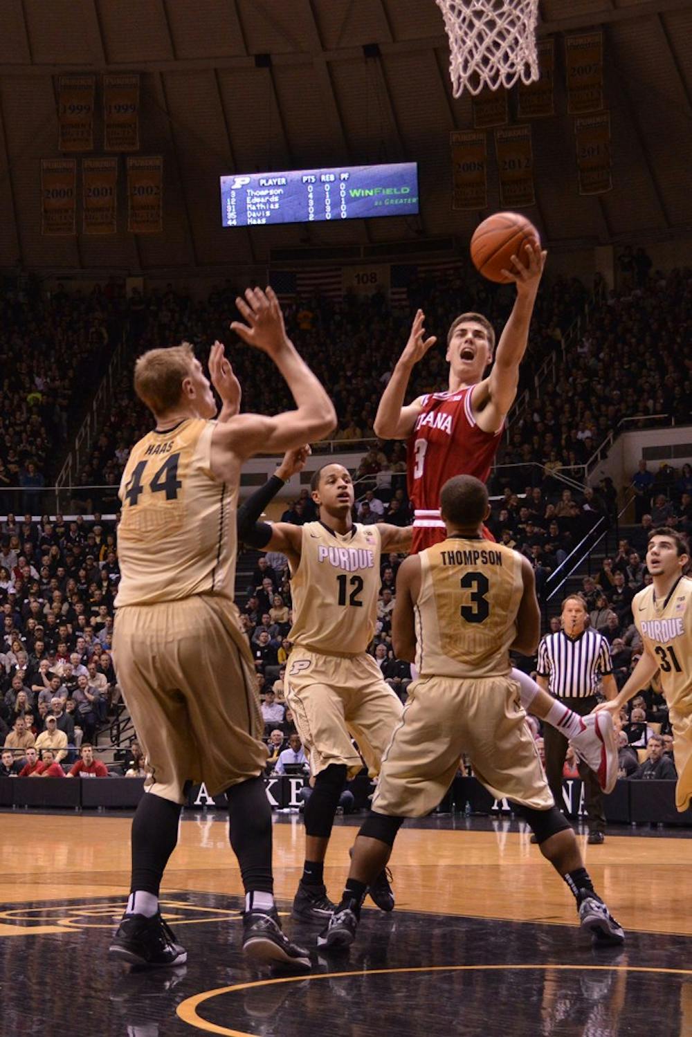 Freshman Max Hoetzel attempts a layup surronded by three Purdue players Wednesday night at Mackey Arena.