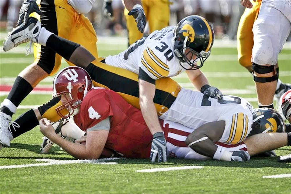 Sophomore quarterback Ben Chappell is tackled at the line of scrimmage during the Hoosiers 45-9 loss to Iowa on Saturday afternoon at Memorial Stadium. The 2-4 Hoosiers suffered its fourth loss in a row.